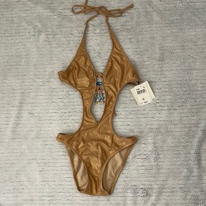 Gold shimmery swimsuit.